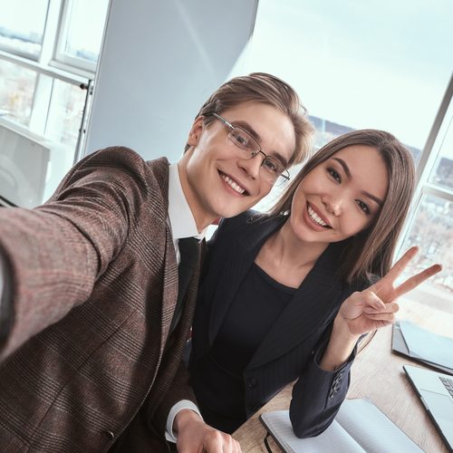 Colleagues taking a selfie at the office