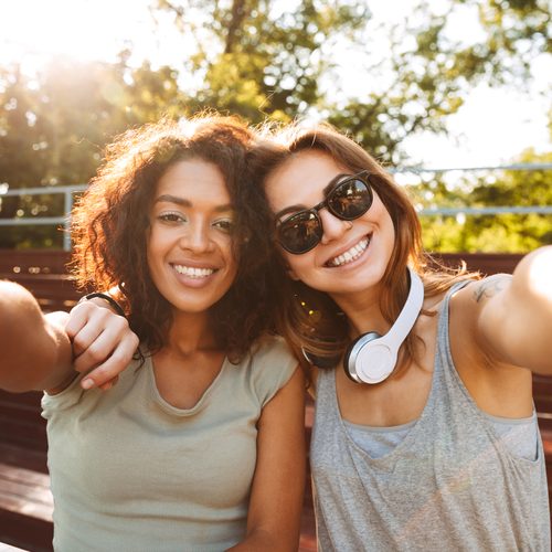 Two friends taking a selfie in the park