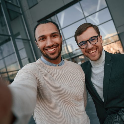Two people taking a selfie after work