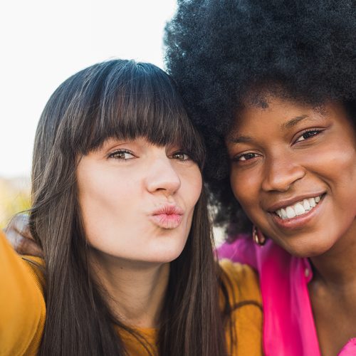 Two friends posing together for a selfie